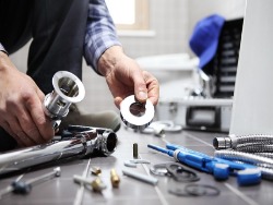 Man with plumbing tools