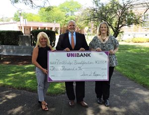 UniBank President Sam Pepper presenting check to Northbridge Beautification co-founders