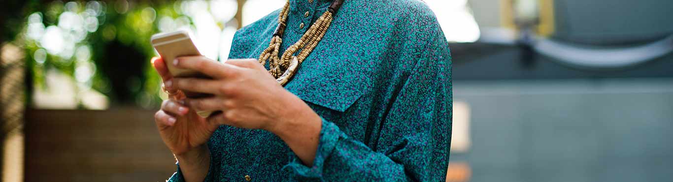 Woman on a mobile device outdoors