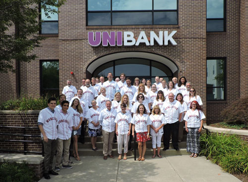 UniBank employees wearing Worcester Red Sox jerseys