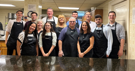 UniBank employees serving food at Daily Bread