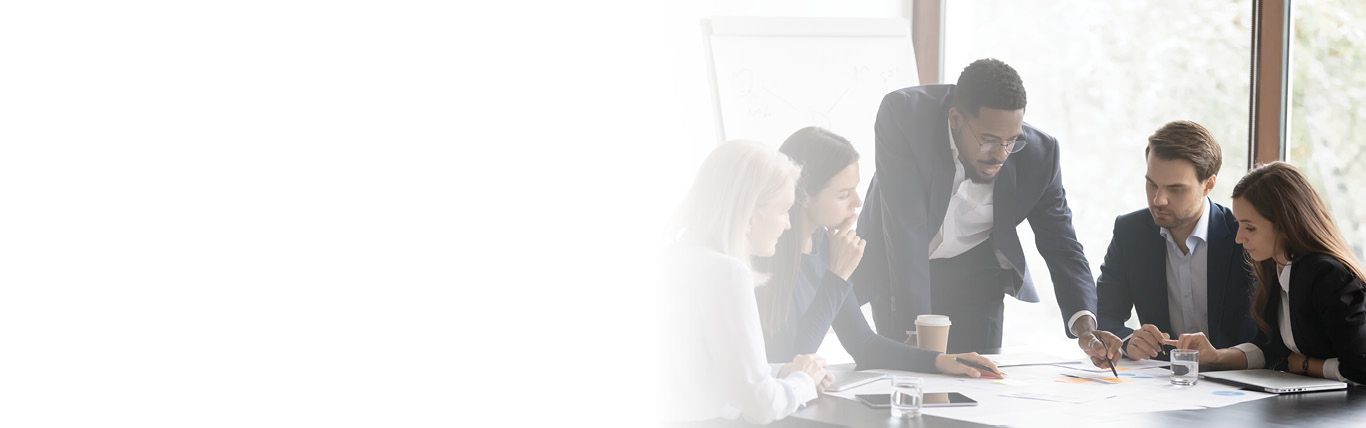 Photo of a group of businesspeople around a table