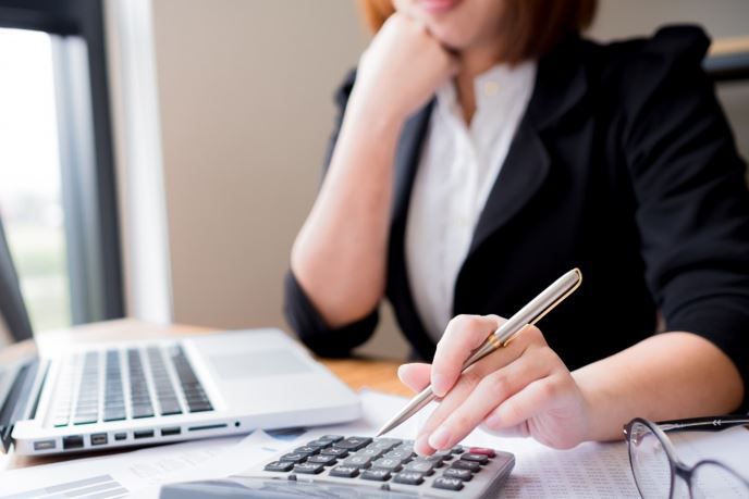 Woman using a calculator